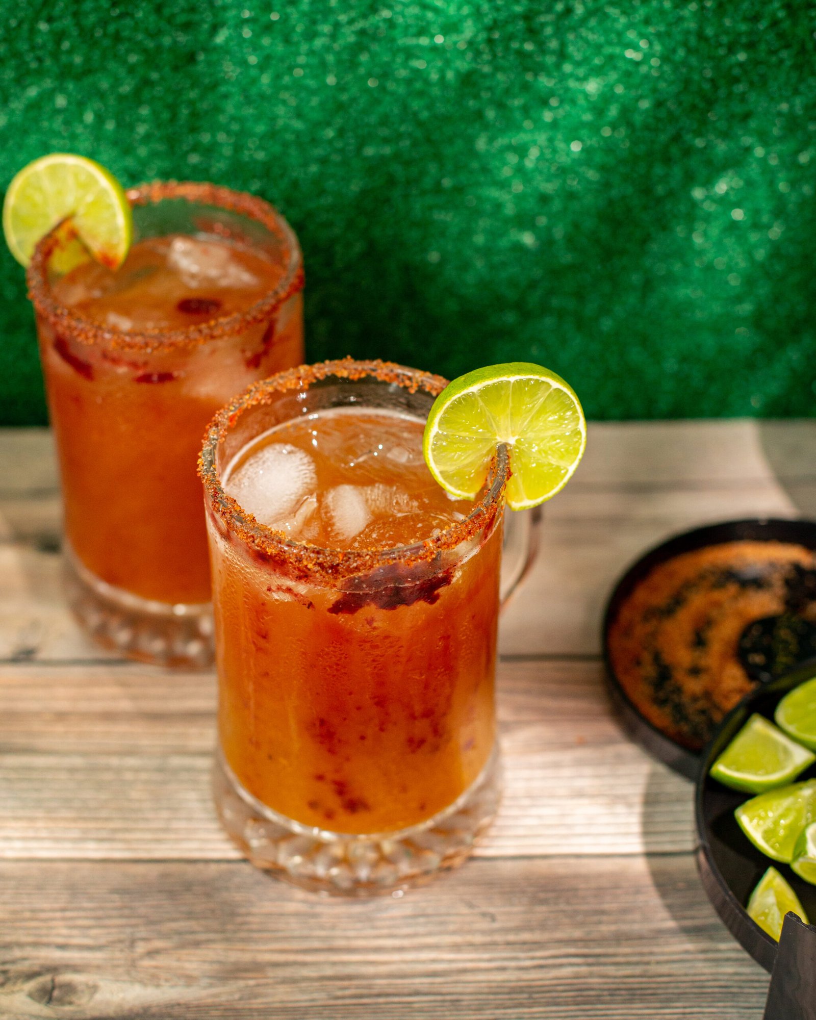 The two glasses full of lime cocktails